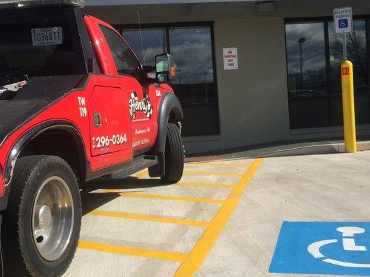 Illegally parked in a handicapped spot, and the driver couldn't even park between the lines.  3/2/2017 in Gaithersburg, MD.