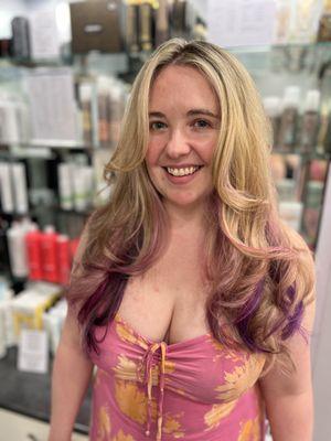 We took her traditional blonde highlights up a notch with some pops of purple and pink.