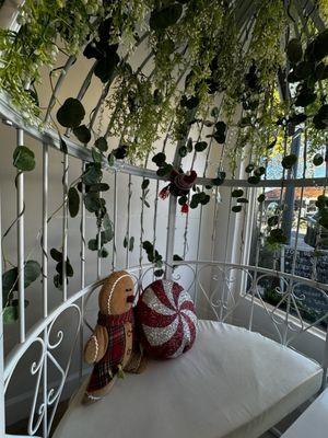 Aesthetic tea room that includes beautiful birdcage seating looking at Main Street!