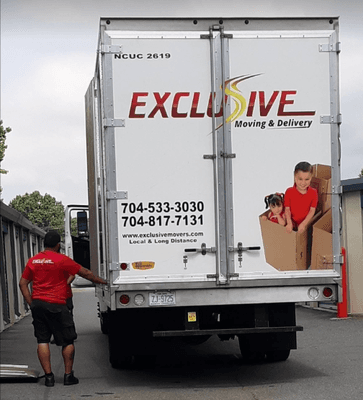 Exclusive Moving and Delivery (back of moving truck)