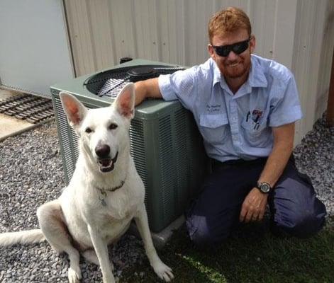 Jimmy, with a new RUUD condenser, and our dog. 