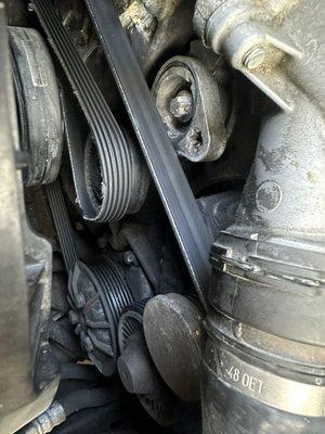 Bmw tensioner pulley damaged and now causing belt damage, easy fix