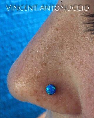 Healed Nostril Piercing with a synthetic Blue Opal.