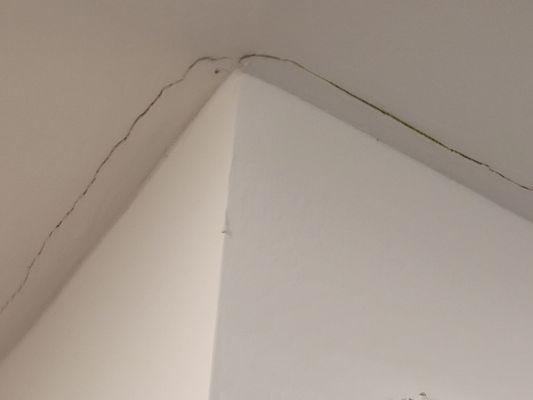 Cracking in ceiling between hall bath and flex room