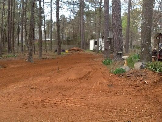 Another photo in the other direction. This area required 11 yards of dirt to get the right crown in the yard to help manage the rain fall.