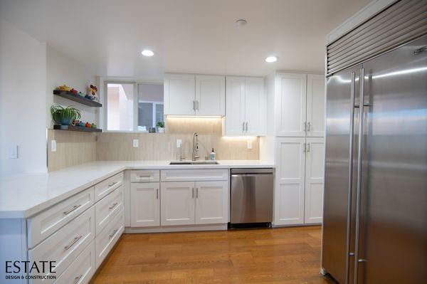 Custom Cabinetry, Quartz Countertops, State-of-the-Art Appliances, Lighting, and Dining Area.