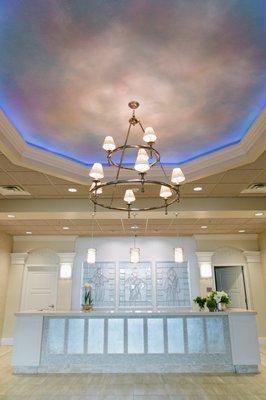 A faux skylight adds color and serenity to this reception area in the Tanner Clinic West Building.