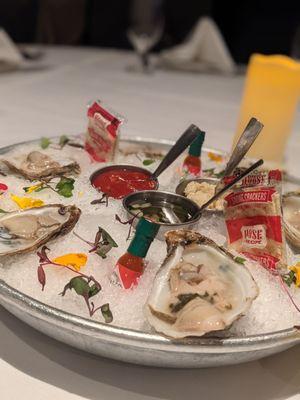 Oysters on a half shelf.