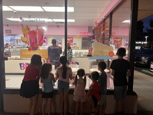 My Grandkids waiting to get there cones on .