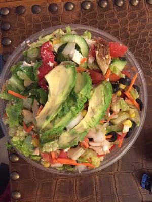 "Greek Salad" lettuce, tomatoes, onions, cucumbers, olives, chicken, carrots, red and green peppers, avocado, a few pieces of broccoli