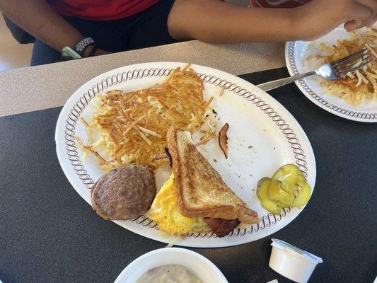 Bacon egg & cheese sandwich with hashbrown