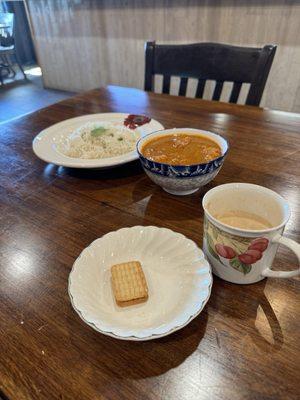 Milk Tea with tea biscuits, and spicy chicken curry with rice.