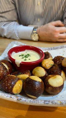 Hot pretzel balls with bechamel cheese sauce