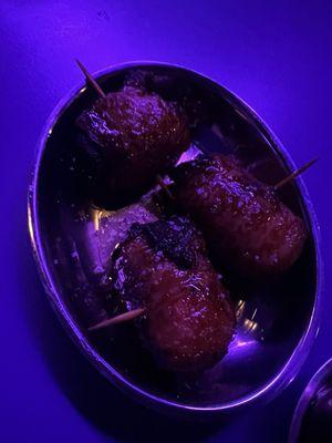 Bacon wrapped dates with queso Cabrales. Happy hour item