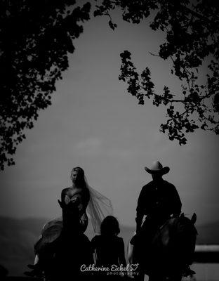 Bride riding horseback in with her father to the ceremony at Hutchinson Ranch in Salida Colorado.