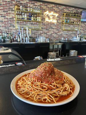 The Giant Meatball atop 5 POUNDS of spaghetti!