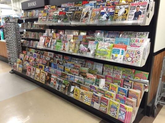 Decent selection of magazines for a grocery store - and a rack of readers!