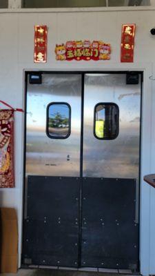 The double silver doors in the garage entrance.