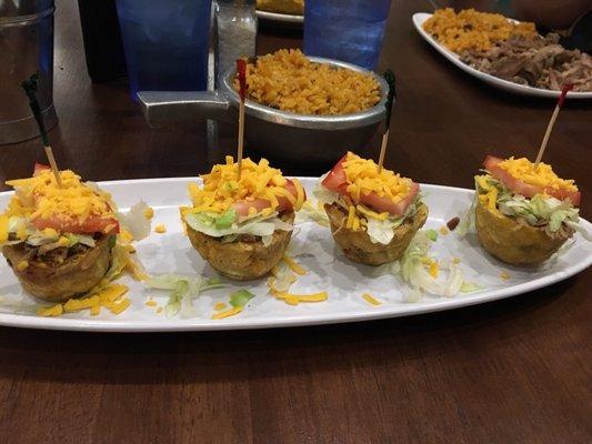 Jibarito cups with a side of arroz con gandules