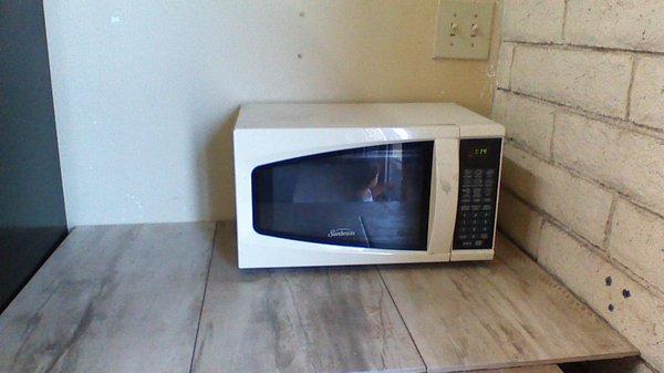 All new Microwave. For your use. We also sell frozen Burritos for under a Dollar!