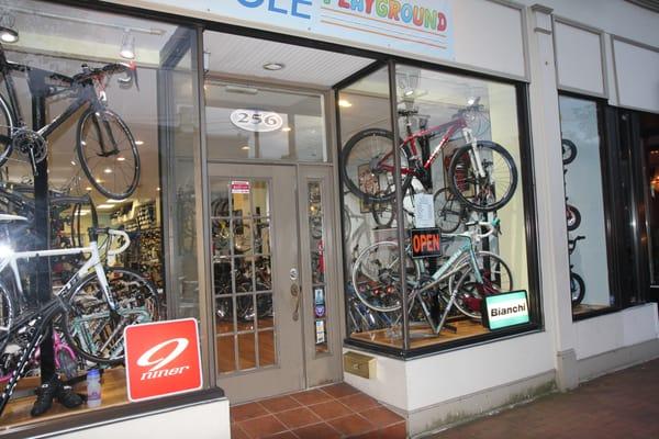 Store Window Display. Pinarello, Parlee, Niner, Moots, Bianchi, another Niner, Kettler trike, and Giant kids bikes.