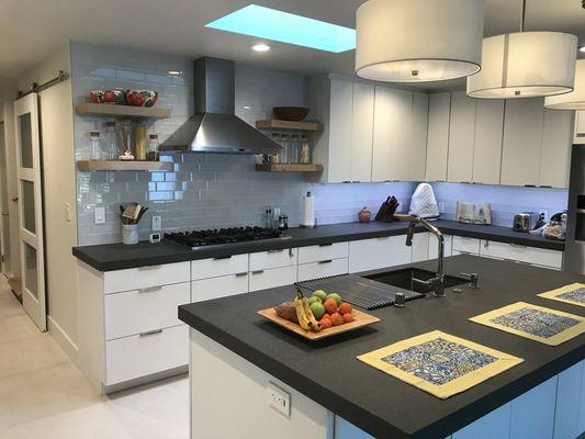 Added skylight, glass backsplash subway tile, under cabinet lighting