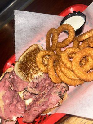 Reuben sandwich with crunchy onion rings and ranch