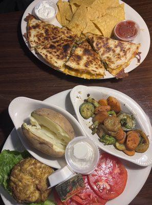 Blackened Chicken Quesadilla with a side of tortilla chips & the Crab Cake Entree with a side of sautéed veggies and a baked potato