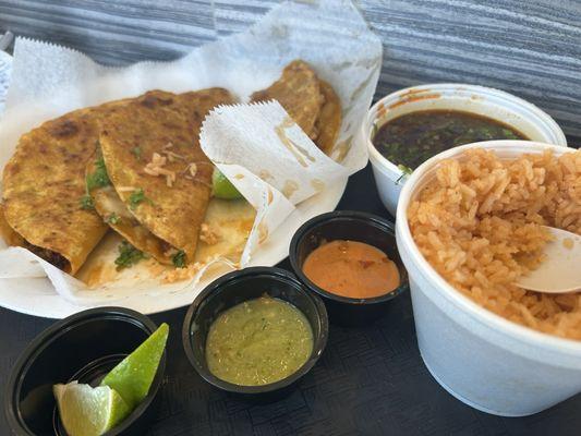 Birria tacos meal comes with 3 tacos and the special juice on the side. beans and rice and the red and green spicey sauce