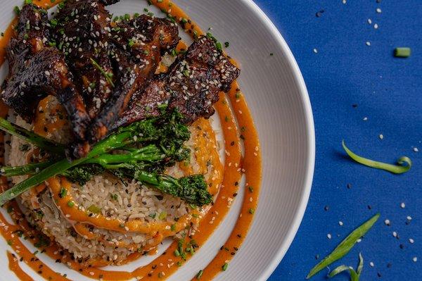 Lamb Chops over Garlic Fried Rice, broccolini and our house sweet garlic aioli