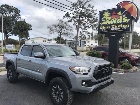 2018 Toyota Tacoma tinted with Llumars Ceramic Film and front windshield tinted with Llumars Air 80