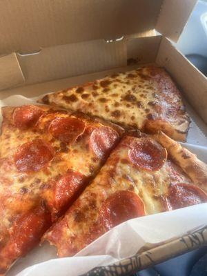 Pepperoni and cheese pizza by the slice