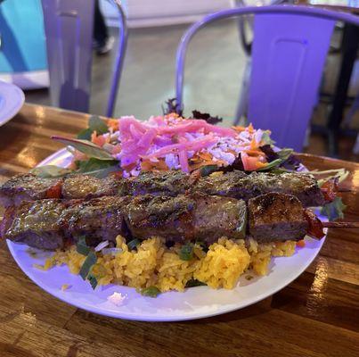 Steak kabobs with rice and house salad