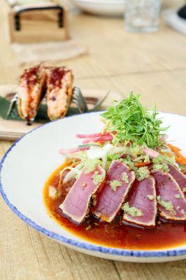 Jerk Spiced Seared Tuna - Ingredients include Daikon Root, Cucumber, Carrot, Watermelon Radish, Cilantro, Citrus Ponzu, & Wasabi Tobiko