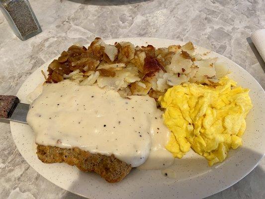 Country fried steak, German potatoes and scrambled eggs.