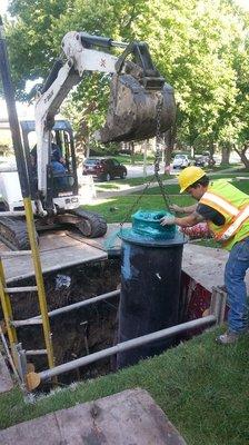 Installing one of our patented "Neverflood" Lift Station Flood Control Systems.