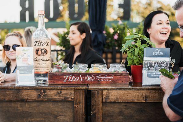 Several Liquid Catering bartenders behind a bar