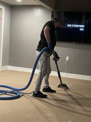 Felix cleaning our living room carpet.