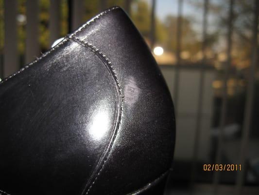 Scuff mark damage on brand new shoes after service at Miracle Mile Shoe Repair.