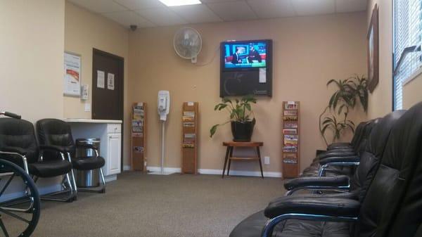 Nice waiting room area with TV.