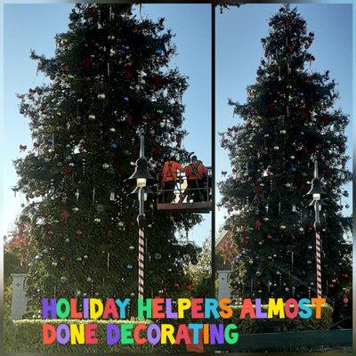 Holiday helpers decorating the permanent sequoia tree on Nov. 19, 2020