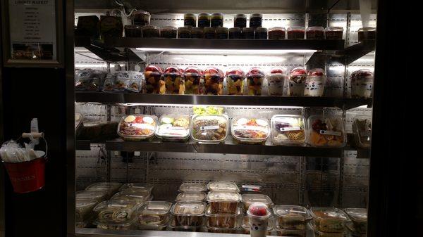 Ready-made cold meals, salads, sandwiches, and desserts.