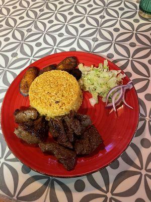 Steak tips with rice, veggies & soft plantain.