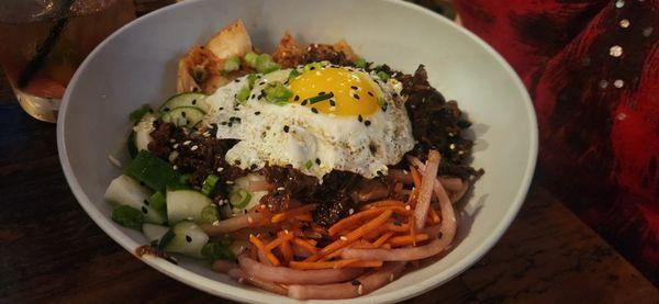 Korean Beef Bowl - winter specials menu??)   marinated beef, kim chi, sticky rice, pickled and assorted veggies, sunny side up egg.