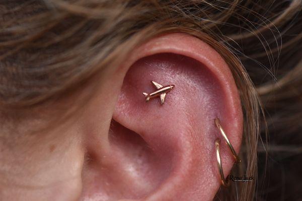 Faux rook taking off with this plane! Piercing by Rena