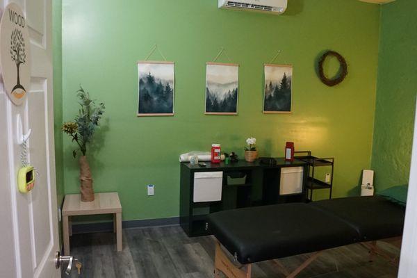 This is our Wood room where we offer low cost acupuncture, cupping, massage, and microneedling while you listen to forest sounds