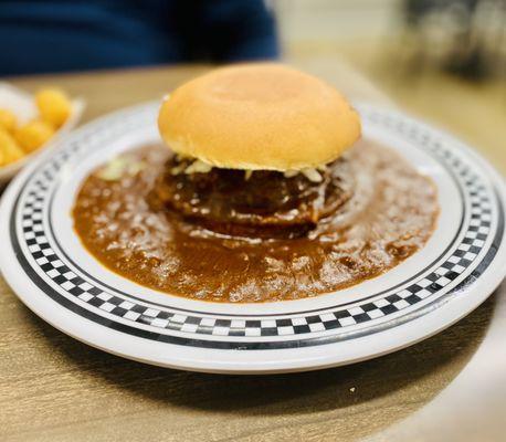 Floating Cheeseburger in house made chili with slaw & tator tots GET IT! :)...