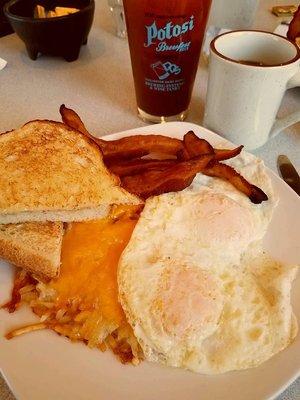 Sat. brunch ~ Perfect eggs over-easy, cheesy hash~browns, hickory smoked bacon and sour-dough toast!