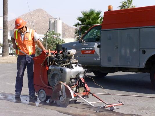 employee cutting concrete