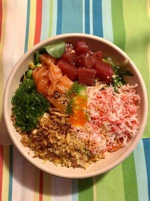 Poke bowl with salmon, tuna, crab, seaweed salad